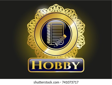  Golden badge with notebook with pencil icon and Hobby text inside