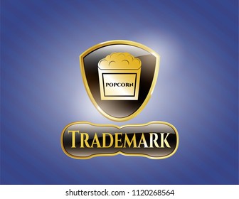  Golden badge with popcorn icon and Trademark text inside