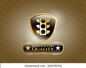   Golden badge with traffic light icon and Focus on Quality text inside