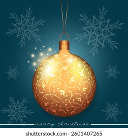 A golden bauble with a swirling pattern design, set against a blue festive scene of scattered snowflakes.
