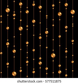 Golden beads at the vertical lines on a black background