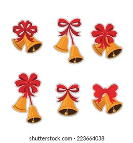 golden bells with a red bow