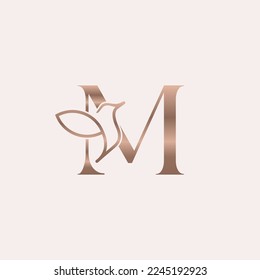 golden bird logo beauty letter M