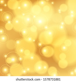 Golden bokeh background. Christmas glowing lights with sparkles. Holiday decorative effect.