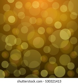 Golden bokeh background with soft light for christmas designs.