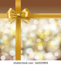 golden bow on bokeh holiday background