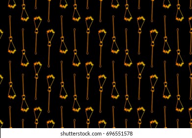 Golden broom on black background - vector pattern, Halloween witches broomstick - vector pattern, witches broom pattern
