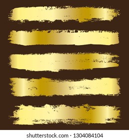 Golden brush strokes set