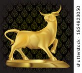 A golden bull. Statue on a black background