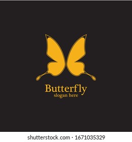 Golden butterfly on black background.logo template for beauty salon,spa salon,etc.