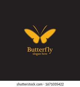Golden butterfly on black background.logo template for beauty salon,spa salon,etc.