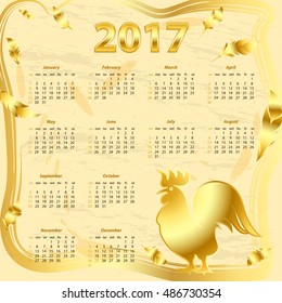 Golden calendar 2017 rooster. It brings good luck. Template with week starts Sunday.
