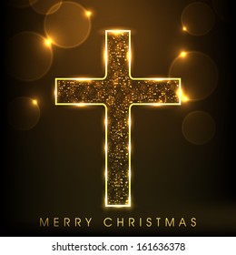 Golden Christian Cross on shiny brown background, Merry Christmas concept.