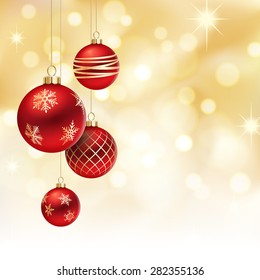 A Golden Christmas background, with 4 multicolored christmas balls decorated with snowflakes, hanging from above