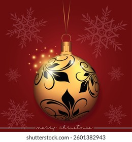 A golden Christmas bauble showcasing a leaf motif design on a red festive background adorned with snowflakes.