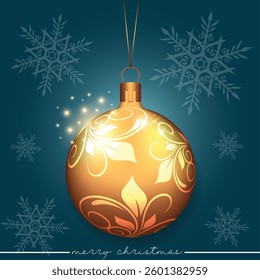 A golden Christmas bauble showcasing a leaf motif design on a blure festive background adorned with snowflakes.