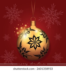 A golden Christmas sphere with a flower pattern set against a red background with snowflakes.