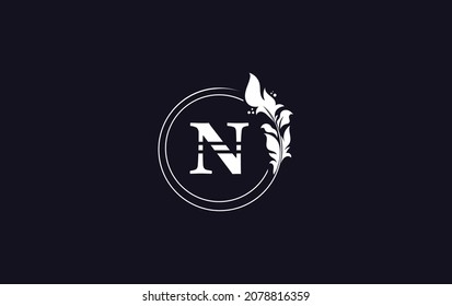 Golden circle leaf and creative art, symbol, logo design with N letters for professional brand and business
