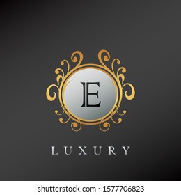 Golden Circle Luxury Letter E  logo. Elegant circle luxury logo with golden color design concept for initial, emblem, luxuries business, wedding service and more brand identity.