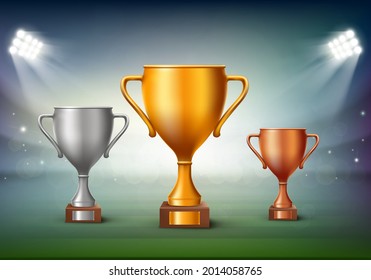 Golden Cup, silver cup and bronze cup on the stadium. Winners reward ceremony. Vector illustration