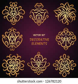 Golden decorative floral elements. Can be used for backgrounds, packaging, invitations,vintage cards, wrapping paper. Vintage design elements