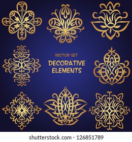 Golden decorative floral elements. Can be used for backgrounds, packaging, invitations,vintage cards, wrapping paper. Vintage design elements