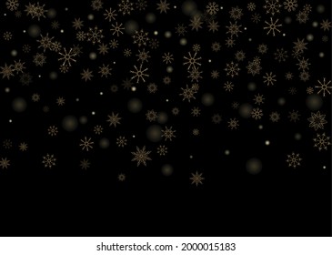 Golden delicate openwork snowflakes scatter on a black background. Festive background, postcard design, wallpaper