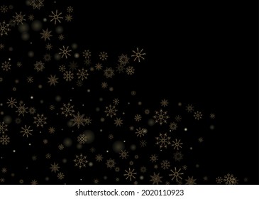 Golden delicate openwork snowflakes scatter on a black background. Festive background, postcard design, wallpaper