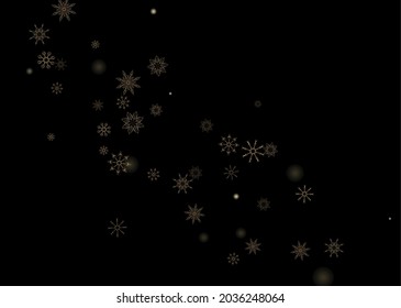Golden delicate openwork snowflakes scatter on a black background. Festive background, postcard design, wallpaper