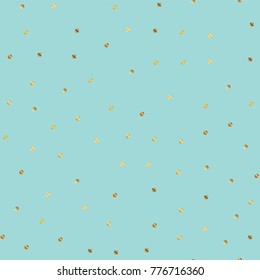 Golden dots seamless pattern on blue brilliant background.