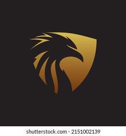 Golden eagle head on shield template design. Vector illustration.
