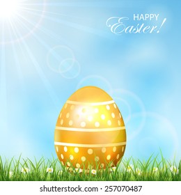 Golden Easter egg in the grass and blue sky, illustration.