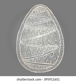 Golden Easter egg isolated zentangl pattern with a pattern of a plurality of strips.