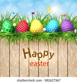 Golden Easter eggs on a wooden background vector illustration.
