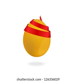 Golden egg with a ribbon
