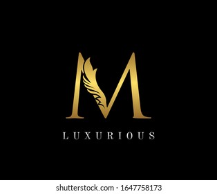 Golden Elegant letter M. Graceful royal style. Calligraphic beautiful logo. Vintage drawn emblem for book design, weeding card, brand name, business card, Restaurant, Boutique, Hotel. 