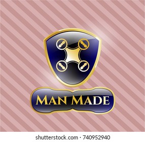  Golden emblem or badge with air drone icon and Man Made text inside