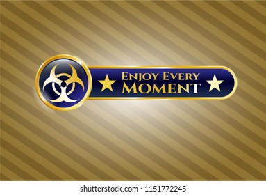  Golden emblem or badge with biohazard icon and Enjoy Every Moment text inside