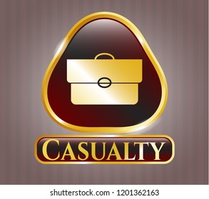  Golden emblem or badge with briefcase icon and Casualty text inside