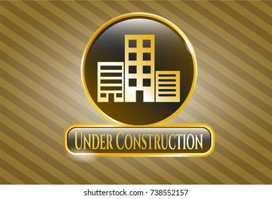  Golden emblem or badge with buildings icon and Under Construction text inside