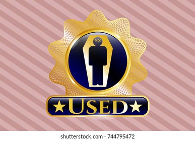 Golden emblem or badge with dead man in his coffin icon and Used text inside