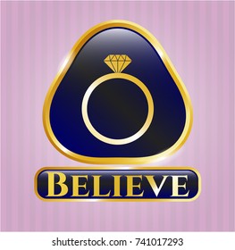  Golden emblem or badge with diamond ring icon and Believe text inside