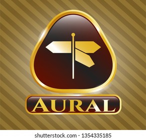  Golden emblem or badge with directions sign icon and Aural text inside