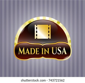  Golden emblem or badge with film icon and Made in USA text inside