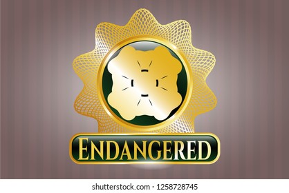  Golden emblem or badge with four leaf clover icon and Endangered text inside