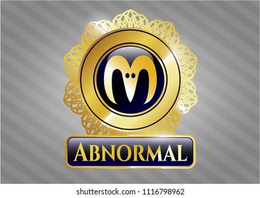 Golden emblem or badge with goat head icon and Abnormal text inside