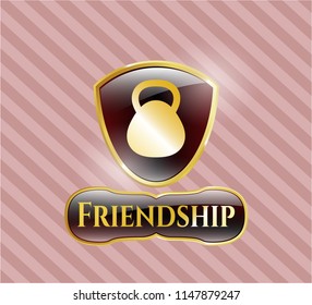 Golden emblem or badge with kettlebell icon and Friendship text inside