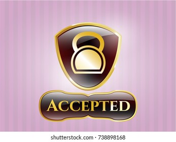  Golden emblem or badge with kettlebell icon and Accepted text inside