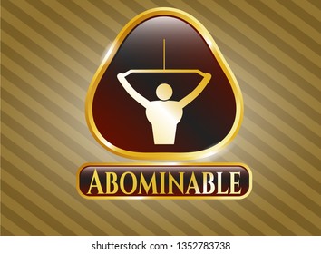  Golden emblem or badge with lat pull down, exercise icon and Abominable text inside