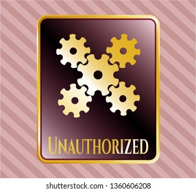  Golden emblem or badge with mechanism icon and Unauthorized text inside